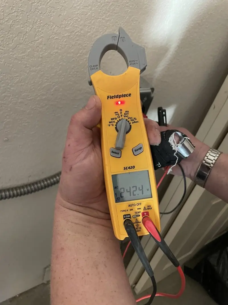 Voltage testing with clamp meter during Generator Installation in Clifton Heights